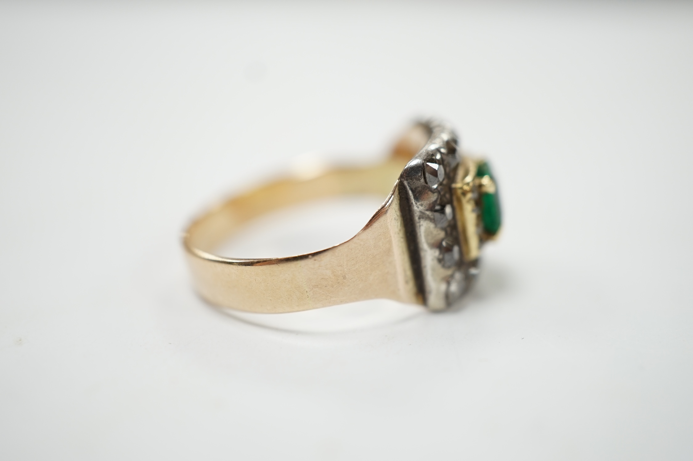 A George III 18ct, emerald and diamond cluster set mourning ring, with engraved inscription, 'H. Goodwin? died 18th Jan, 1790, aged 63', size S, gross weight 5.5 grams. Condition - fair